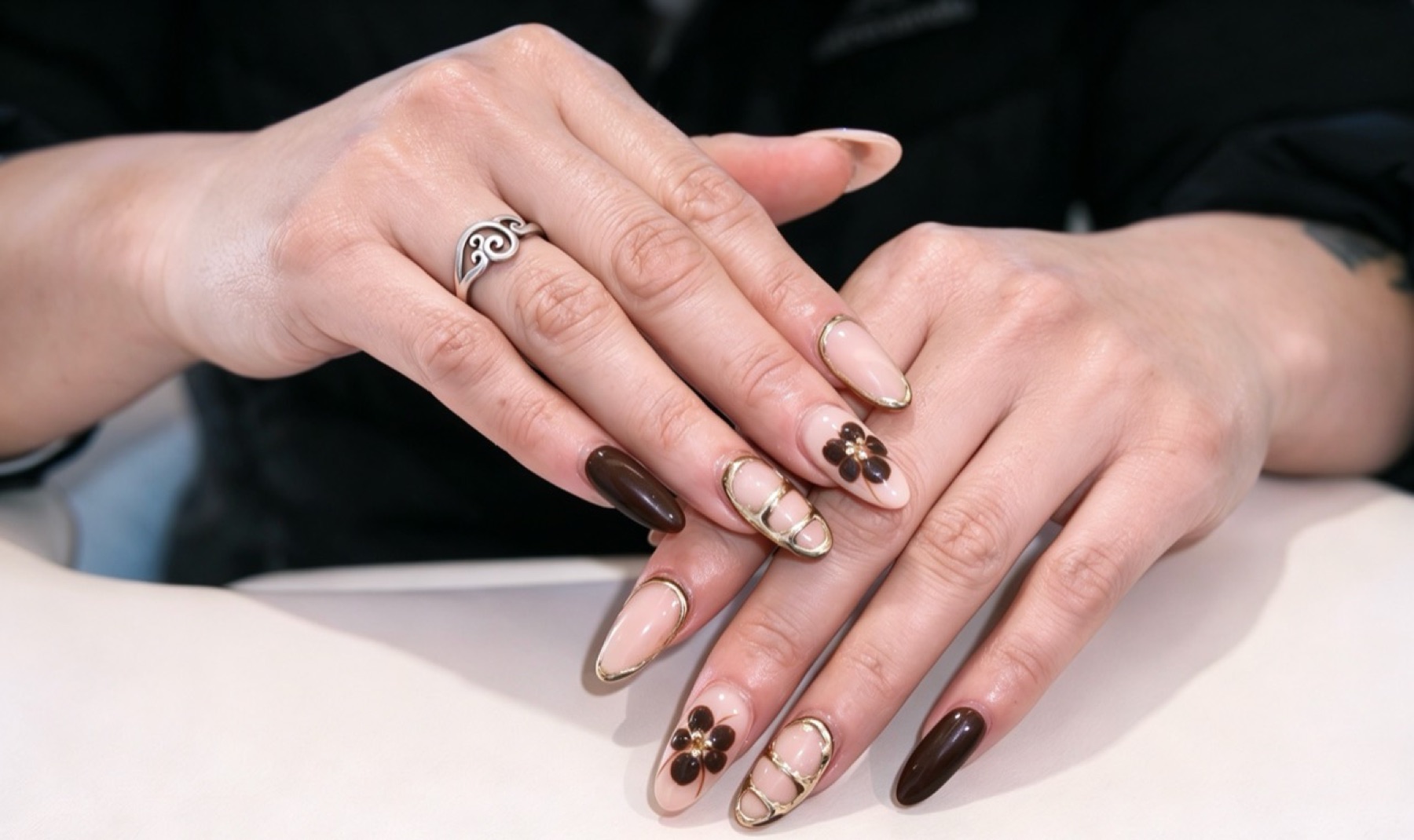 Finished nail art displayed over a salon table
