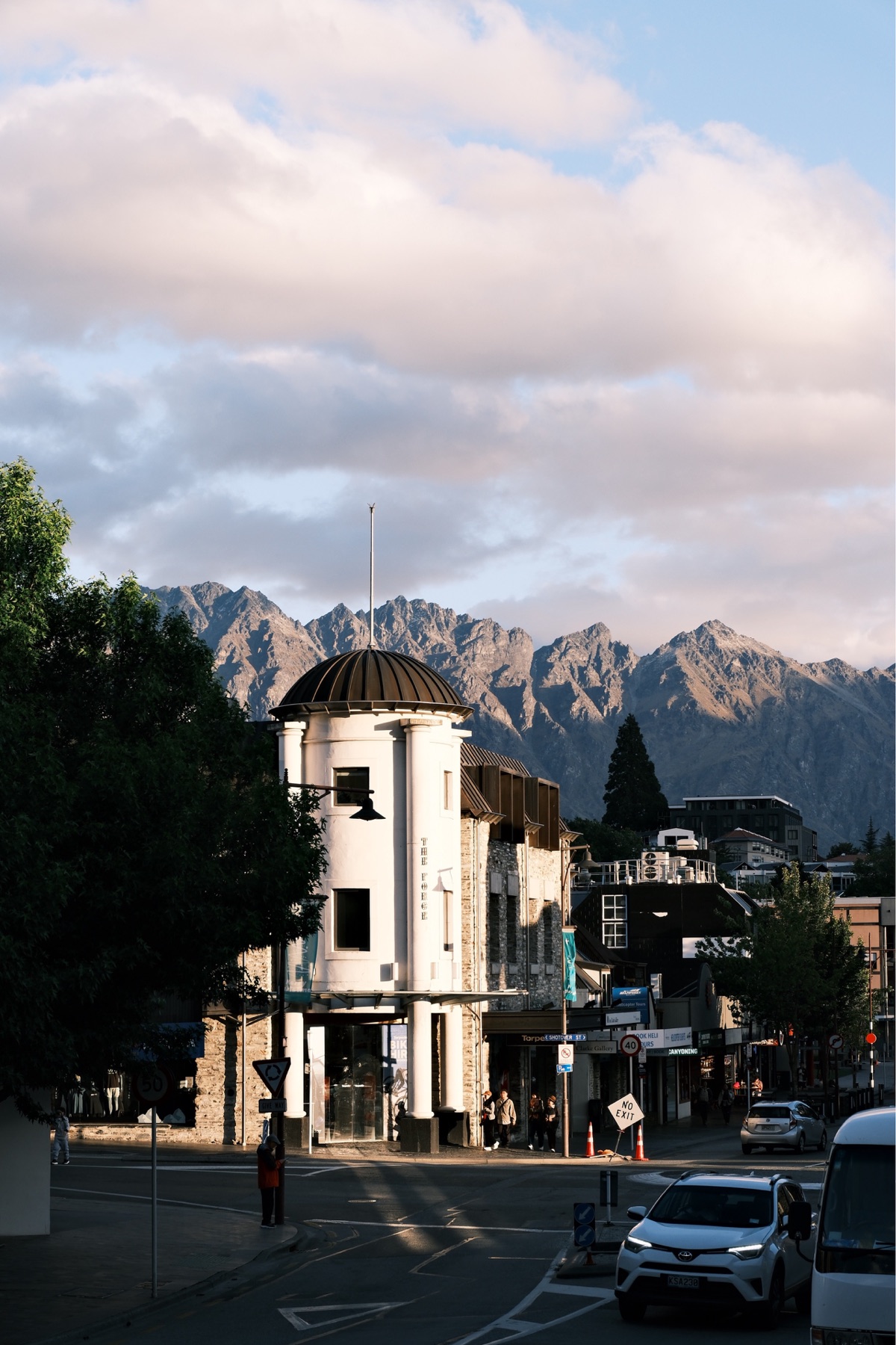 Queenstown waterfront and mountains beneath a blue sky